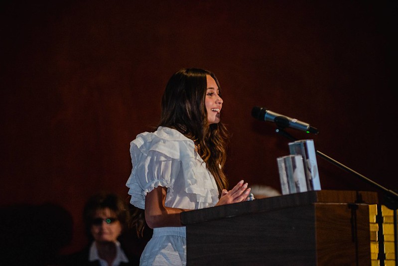 Lennon Spektor speaking at awards ceremony